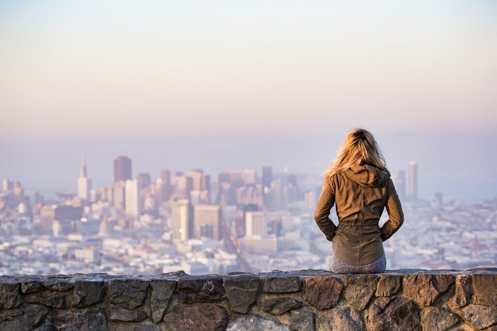 Girl overlooking city skyline