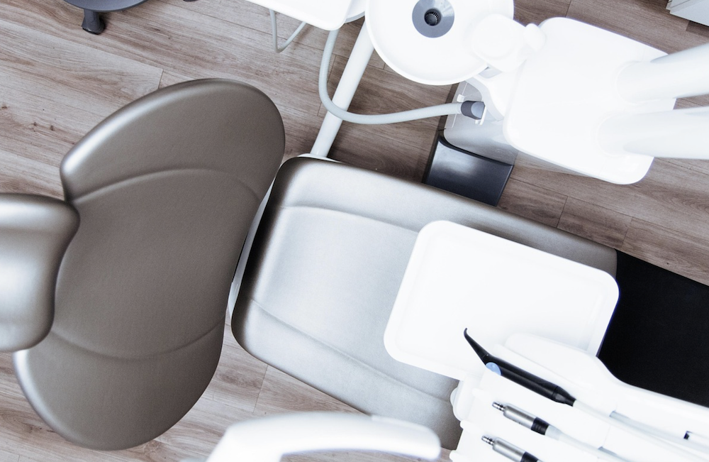 Medical chair that appears to be for a dental exam.